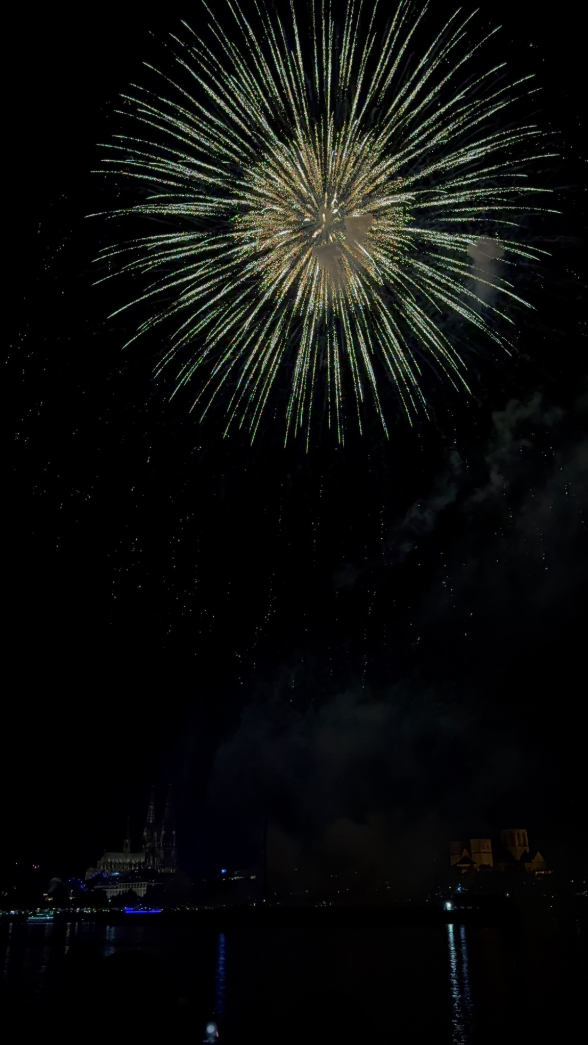 Fireworks over a city skyline at night