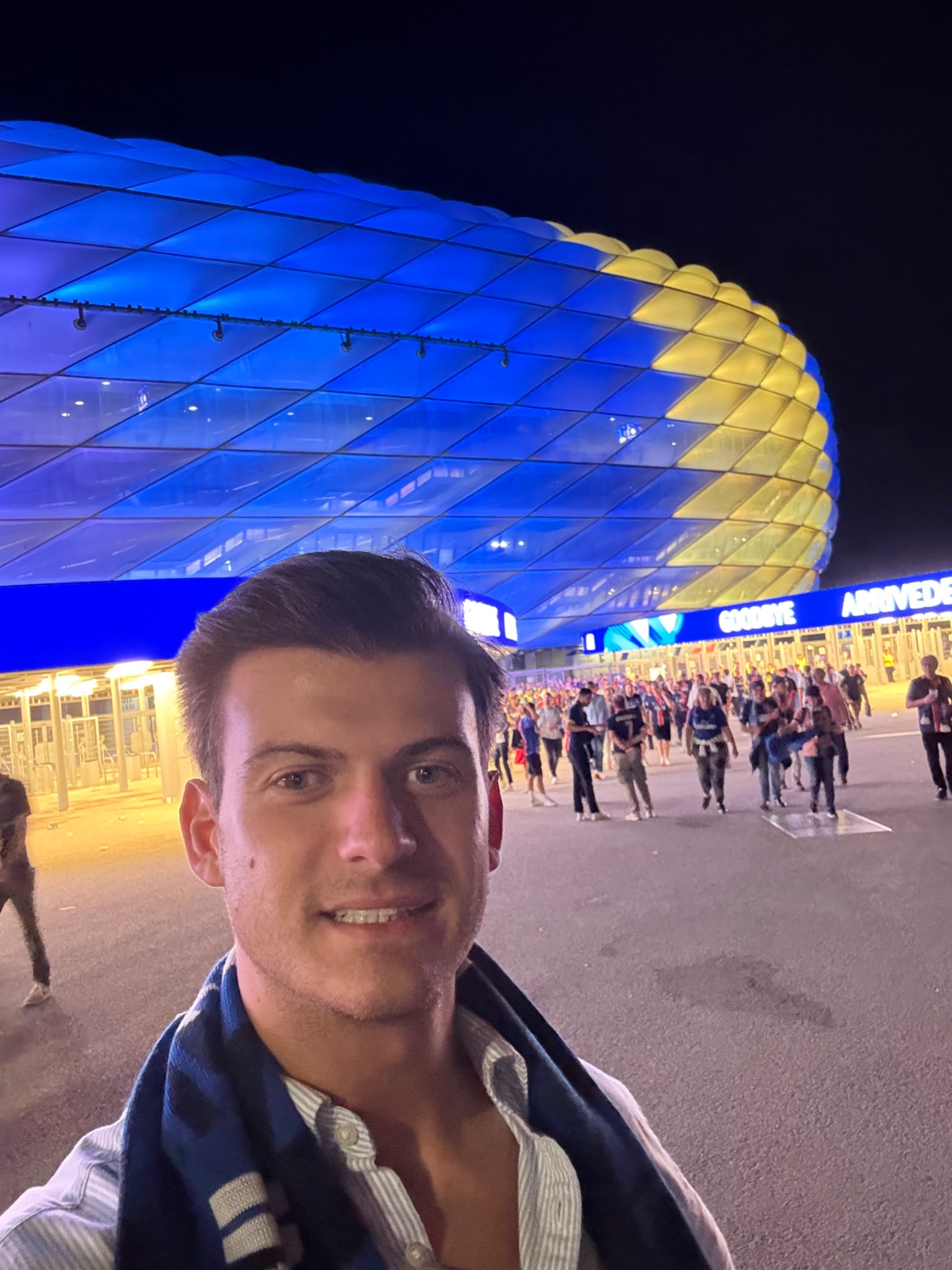 Selfie with a glowing stadium in the background